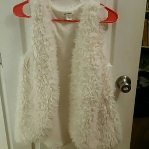White fur vest